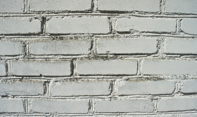 Fototapeta premium old white weathered brick wall, background or texture.