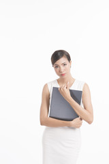 Business woman standing, holding file and waring white dress