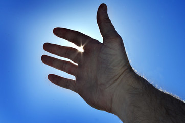 Reaching Hand to Heaven Seeking Light