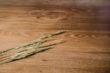 ear of rice on wooden board