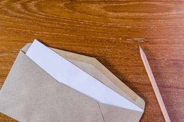 Blank notepad and brown envelope