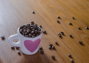 roasted coffee beans in coffee cup