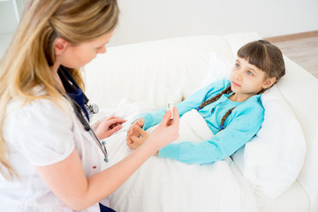 Doctor visiting sick girl