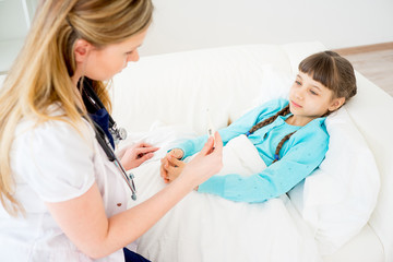 Doctor visiting sick girl