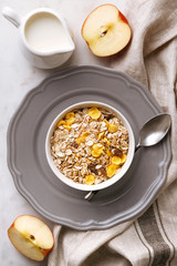 Flat lay oatmeal with milk and apples. Fresh and healthy breakfast from above. Top view