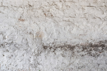 Vintage white   dirty plaster wall with  stucco layer texture.