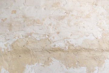 Fototapeta premium Rugged stucco white painted wall surface texture. Vintage background.
