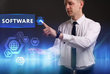 Business, Technology, Internet and network concept. Young businessman working on a virtual screen of the future and sees the inscription: Software