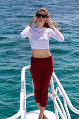 model on background sea and yacht