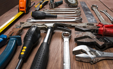 Set of hand tools on a wooden table