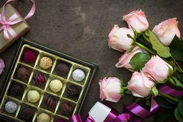 Pink rose present and truffle. Holiday background. Mothers day concept.