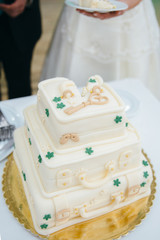 Vertical shot of a wedding cake in a form of suitcase