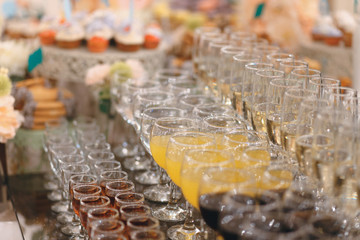 Rows of alcoholic drinks prepared for fourchette