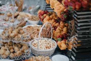 Wedding candy bar with nuts, fruits and pastry