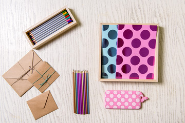 Various colored pencils near envelopes