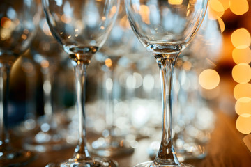 Close up picture of empty glasses on the wooden counter  in restaurant