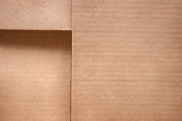 Folded cardboard box cover close up. Texture and background