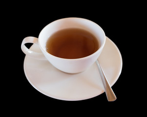 cup of hot tea on black background