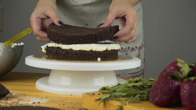 Pouring frosting on Cake. Making Chocolate Layer Cake. Series.