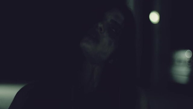 Female zombie chasing man slow motion closeup