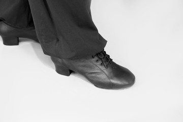 Feet of adult man. Salsa dancer