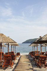 Sun loungers on the pebble beach in Budva in Montenegro.