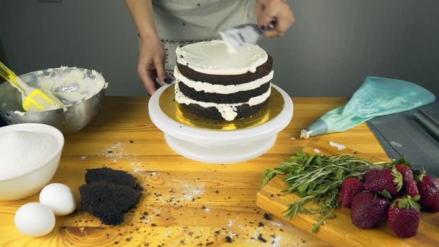 Pouring frosting on Cake. Making Chocolate Layer Cake. Series.