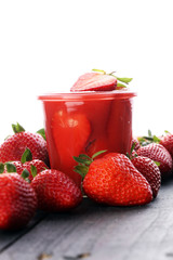 Fresh strawberry smoothie on wooden table