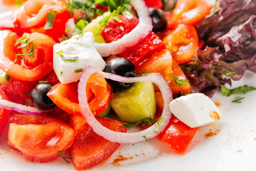 Fresh Greek salad with onion. Close up with selective focus