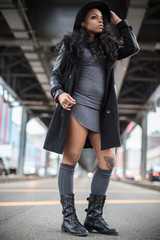 A portrait of a young, black woman, posing in the streets of Brooklyn, New York City.