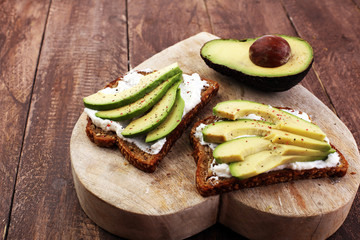 sliced avocado on toast bread with spices and avocado