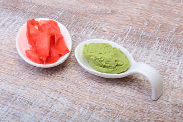 plate with Japanese wasabi sauce and pickled ginger.