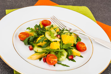 Fruit and vegetable salad with arugula