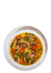 mushroom soup with rice and vegetables. top view. isolated on white