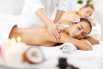 Poster Two beautiful women getting massage in spa © Kalim