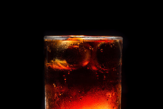 closeup ice cola cooling with fizzy bubble