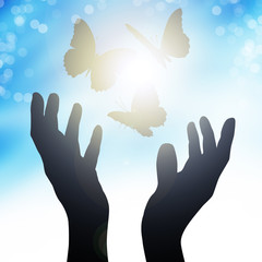 hands reach to the sun, releasing butterflies