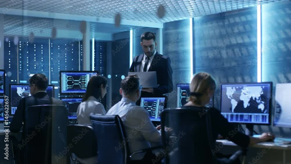 Aufkleber Professional IT Engineers  Working in System Control Center Full of Monitors and Servers. Possibly Government Agency Conducts Investigation.  Shot on RED EPIC-W 8K Helium Cinema Camera.