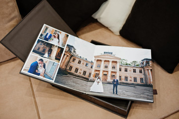 Open pages of brown luxury leather wedding book or album.