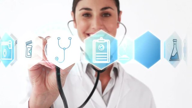 Smiling doctor holding stethoscope that shows various icons