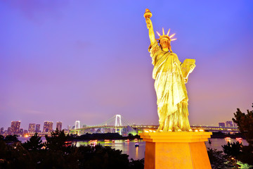 Statue of Liberty and Rainbow Bridge at Tokyo Bay at night