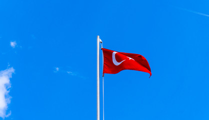 turkish flag waving in blue sky