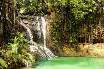 Rainforest waterfall in the deep jungles. Background shot.