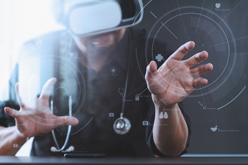 smart doctor wearing virtual reality goggles in modern office with mobile phone using with VR headset with screen icon diagram