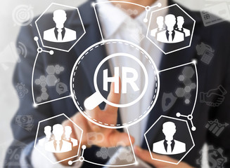 Human Resource Business Concept. Businessman presses hr magnifier icon on virtual screen on...