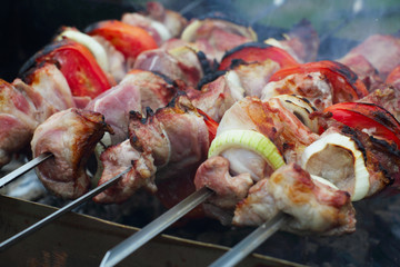 Grilling shashlik on barbecue grill