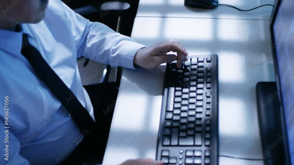 Aufkleber dolly shot of engineers hands typing on keyboards in monitoring room. shot on red epic-w 8k helium c
