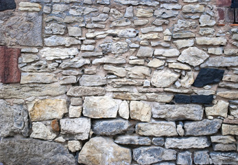 Alte Natursteinmauer mit unterschiedlichen Steinen, Textur, Hintergrund, Textfreiraum 