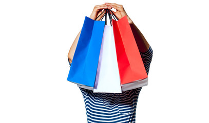 young fashion-monger holding shopping bags on white