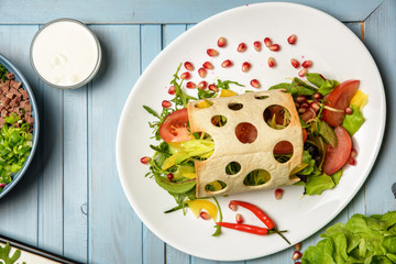Appetizing plate with salad